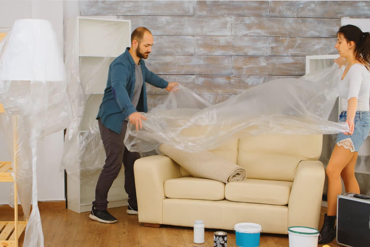 Covering furniture with plastic sheet